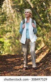 Attractive Middle Aged Woman Hiking In Mountain