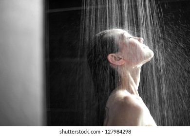 Attractive Mixed Asian Female looking up enjoying the shower