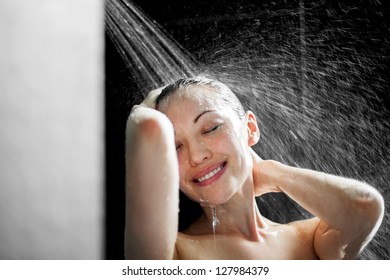 Attractive Mixed Asian Female smiling and enjoying her shower