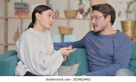 Attractive Mixed Race Couple having Conversation at Home  - Powered by Shutterstock