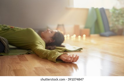 Attractive Mixed Race Woman Doing Restorative Yoga