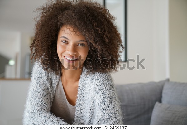 Attractive Mixedrace Woman Relaxing On Sofa Stock Photo Edit Now