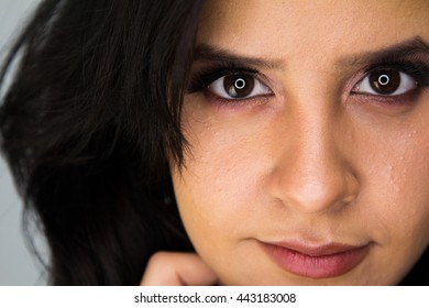 Attractive model looking into the camera on a background