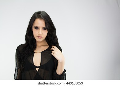 Attractive model looking into the camera on a background