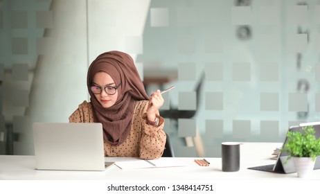 Attractive Muslin Woman Working In Office