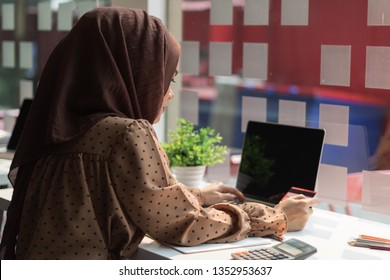 Attractive Muslin Woman Working In Office