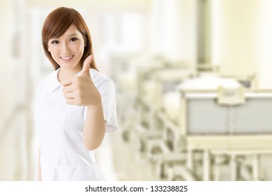 Attractive Nurse Give You An Gesture Of Excellent, Closeup Portrait At Hospital.