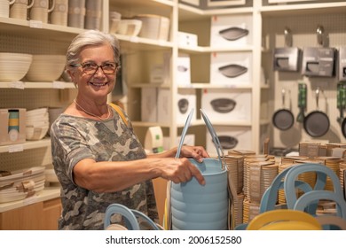 Attractive Older Woman Enjoying Shopping In A Home Improvement Store, Looking Smiling At Camera