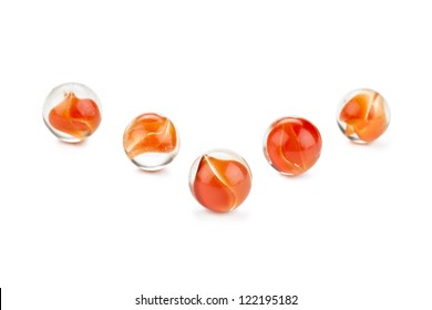 Attractive orange marbles for kids against white background