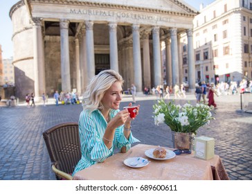 Attractive Pensive Blond Woman Drinking Italian Coffee In The Morning And Seeting In A Street Cafe In Rome