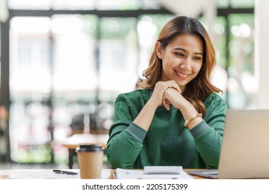 Attractive Pretty Asian Business Woman Working On Laptop At Workstation Office Workplace.