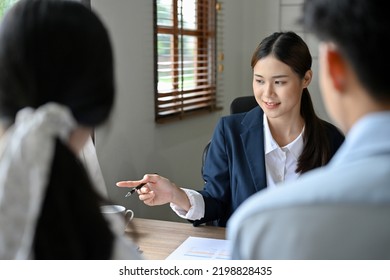 Attractive And Professional Asian Female Boss Or Businesswoman Is Interviewing Two Candidates In Her Office. Job Employment To Recruitment Concept