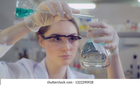 Attractive professional scientist carrying out failed experiments. Portrait doctor or lab technician working in microbiological or chemistry or medical laboratory.Adult beautiful caucasian model
