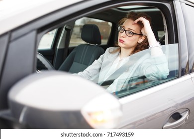 Attractive Red Hair Businesswoman Stuck In A Traffic Jam.Running Late To Work.