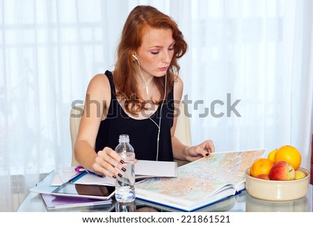 attractive red hair freckled woman study at home , home education and learning