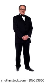 Attractive Senior Man Posing In Tuxedo Isolated Over White Background