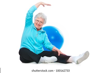 Attractive Senior Woman At Health Club, Doing Stretching Exercises