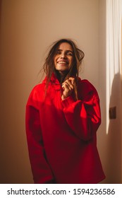 Attractive sexy woman wear red hoody. Girl look sexy and happy. Elegant look. Brunette model wearing casual outfit. Winter, fall autumn or spring minimal outfit. Woman is flirting. - Shutterstock ID 1594236586