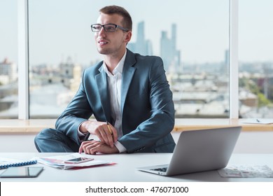 Man suit sitting table Images, Stock Photos & Vectors | Shutterstock