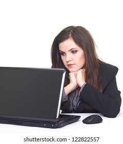 Attractive Smiling Young Woman In A Black Jacket, Working On Laptop And Looking At The Screen. Isolated On White Background