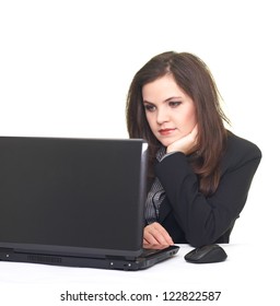 Attractive Smiling Young Woman In A Black Jacket, Working On Laptop And Looking At The Screen. Isolated On White Background