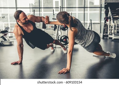 Attractive Sports People Are Working Out Together In Gym