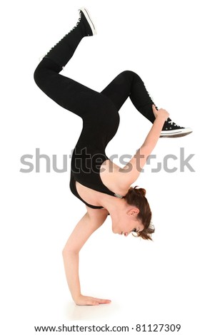 Attractive strong flexible girl teen doing handstand over white with clipping path.