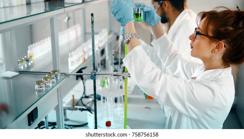 Attractive student of chemistry working in laboratory - Shutterstock ID 758756158