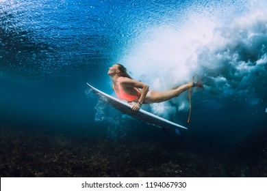 Attractive Surfer Woman Dive Underwater With Under Wave.