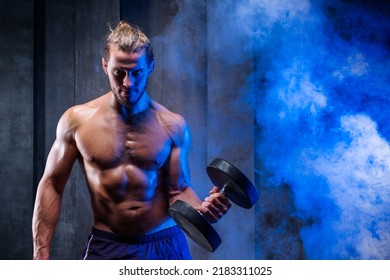 Attractive Tall Muscular Bodybuilder With Naked Torso Doing Exercises. Lifting Dumbbells For Bigger Biceps. Close Up Handsome Man With Big Biceps Lifting Weights. Fitness Center, Healsy Life Concept.