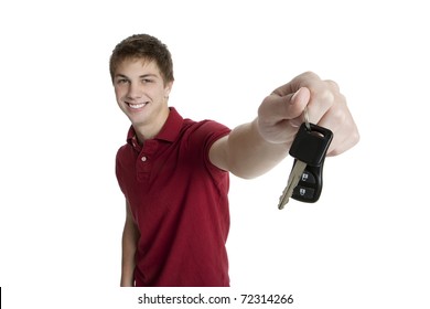 Attractive Teenage Boy Holding Car Keys Isolated On White Background