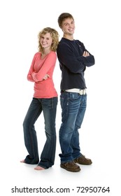 Attractive Teenage Couple Standing Back To Back With Arms Crossed Isolated On White Background