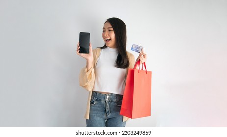 Attractive Teenage Girl, Showing Joy, Online Shopping, Online Payment Via Smartphone, Credit Card Payment, Online Payment Technology, Convenience In Purchases And Payments.