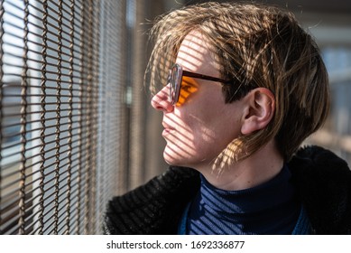 Attractive Thirty Year Old Woman , Eyes Closed With Hard Shadow Lines On Her Face