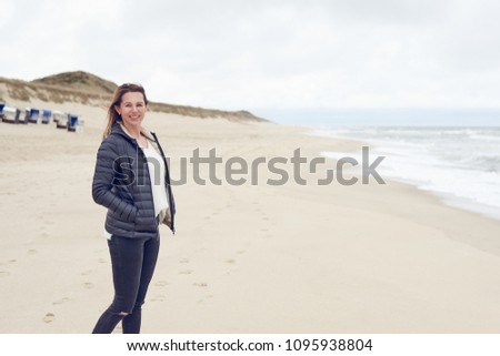 Similar – Pretty healthy woman enjoying a hike on a beach