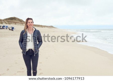 Similar – Pretty healthy woman enjoying a hike on a beach