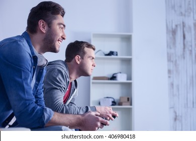 Attractive Two Guys Are Competing In Play Station