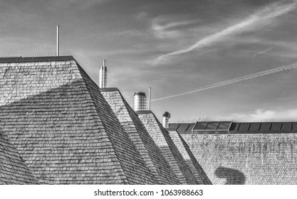 Attractive unusual roof shapes made from wooden tiles, Brockholes, Preston, Lancashire, UK - Shutterstock ID 1063988663