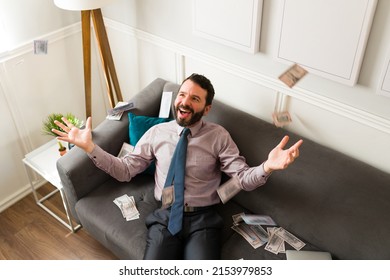 Attractive Wealthy Man Smiling And Throwing Money In The Air After Reaching Financial Security At His Job