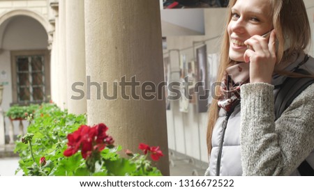 Similar – Image, Stock Photo Twin sisters laughing at a postcard in Erfurt