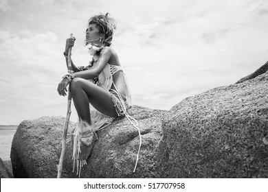 Attractive wild boho woman at beach