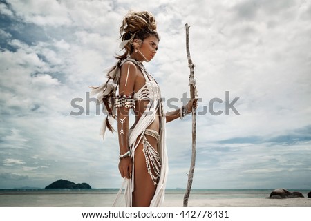 Attractive wild boho woman at beach