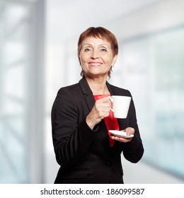 Attractive Woman 50 Years With Cup Of  Coffee