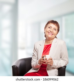 Attractive Woman 50 Years Old With Cup Of  Coffee