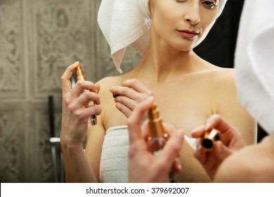 Attractive Woman Applying Parfume.