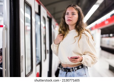 Attractive Woman With Backpack, Entering The Modern Subway Carriage