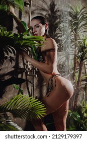 Attractive woman in bikini wash her body in exotic Thailand shower