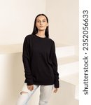 Attractive woman in black long sleeve shirt. Cotton sweatshirt. Summer or autumn clothes