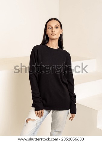 Attractive woman in black long sleeve shirt. Cotton sweatshirt. Summer or autumn clothes