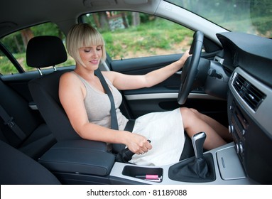 Attractive Woman In The Car Using Hand Brake